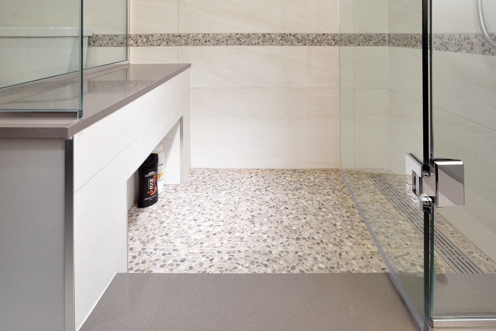 This is an example of a medium sized contemporary shower room bathroom in Toronto with flat-panel cabinets, black cabinets, a corner shower, grey walls, ceramic flooring, a submerged sink and granite worktops.