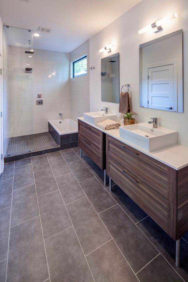 Large contemporary ensuite bathroom in Austin with shaker cabinets, medium wood cabinets, a corner bath, a corner shower, white tiles, porcelain tiles, grey walls, slate flooring, a built-in sink, engineered stone worktops, grey floors and an open shower.