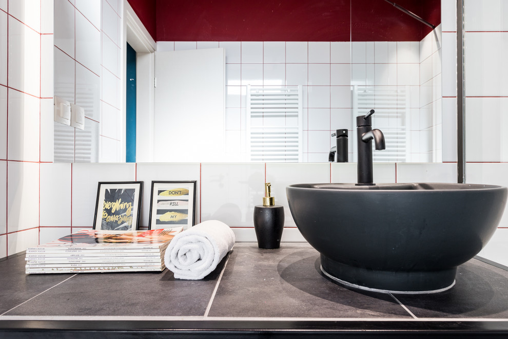 Photo of a modern bathroom in Other with ceramic tiles, red walls, tiled worktops, grey floors and grey worktops.