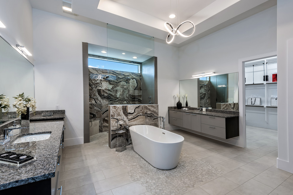 Пример оригинального дизайна: главная ванная комната в современном стиле с плоскими фасадами, серыми фасадами, отдельно стоящей ванной, двойным душем, разноцветной плиткой, плиткой из листового камня, белыми стенами, врезной раковиной, бежевым полом и открытым душем