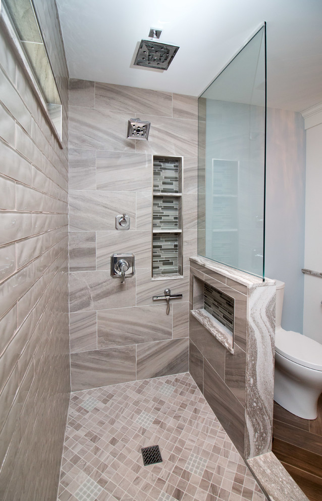 Inspiration for a medium sized modern ensuite bathroom in Boston with beaded cabinets, white cabinets, an alcove shower, a two-piece toilet, multi-coloured tiles, porcelain tiles, blue walls, porcelain flooring, a submerged sink, engineered stone worktops, brown floors, brown worktops and a hinged door.
