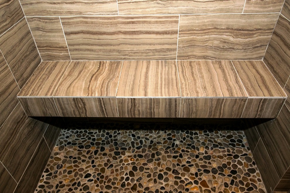 This is an example of a large contemporary ensuite bathroom in Miami with a vessel sink, flat-panel cabinets, dark wood cabinets, engineered stone worktops, a freestanding bath, an alcove shower, a one-piece toilet, brown tiles, porcelain tiles, multi-coloured walls and porcelain flooring.