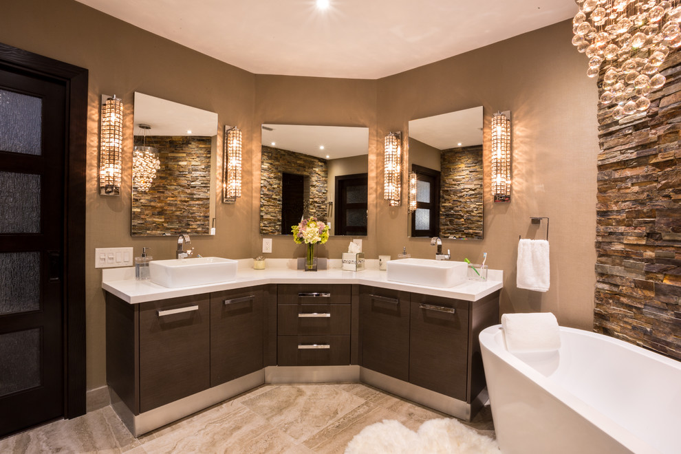 Large contemporary ensuite bathroom in Miami with a vessel sink, flat-panel cabinets, dark wood cabinets, engineered stone worktops, a freestanding bath, an alcove shower, a one-piece toilet, brown tiles, porcelain tiles, beige walls and porcelain flooring.