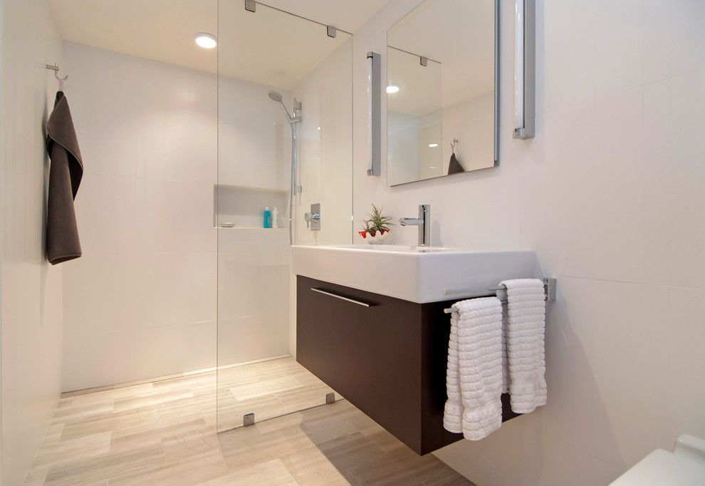 Small modern shower room bathroom in Portland with a trough sink, flat-panel cabinets, dark wood cabinets, white tiles, porcelain tiles, white walls, travertine flooring, a built-in shower, grey floors and an open shower.