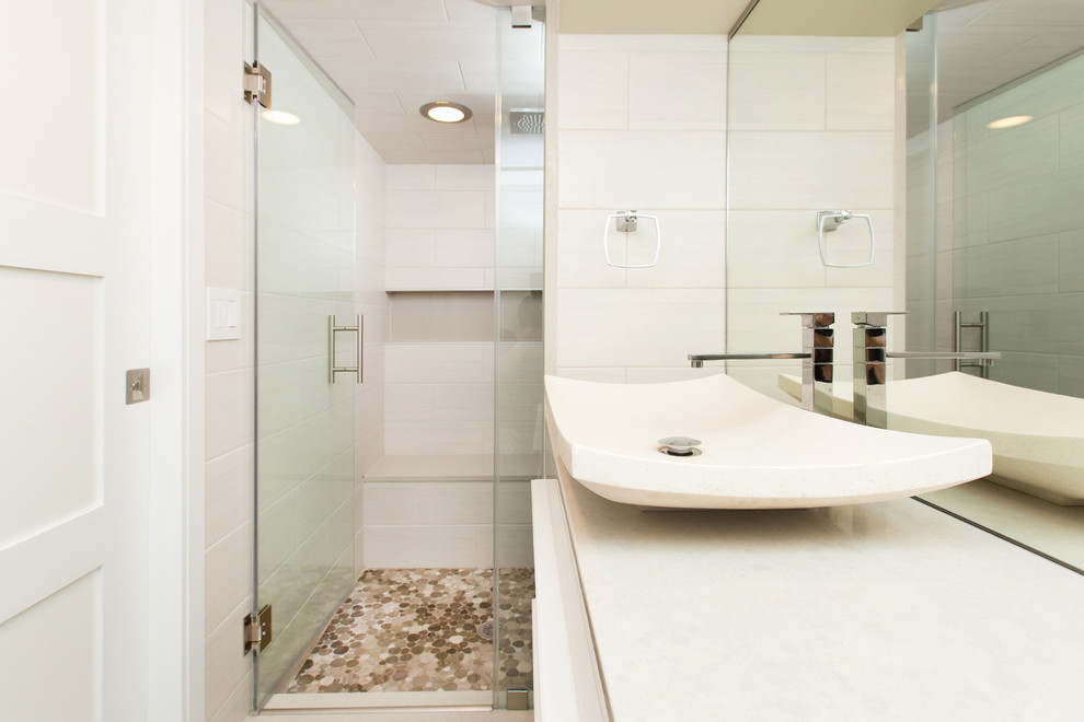 Inspiration for a medium sized contemporary shower room bathroom in DC Metro with flat-panel cabinets, white cabinets, an alcove shower, pebble tiles, beige walls and a vessel sink.