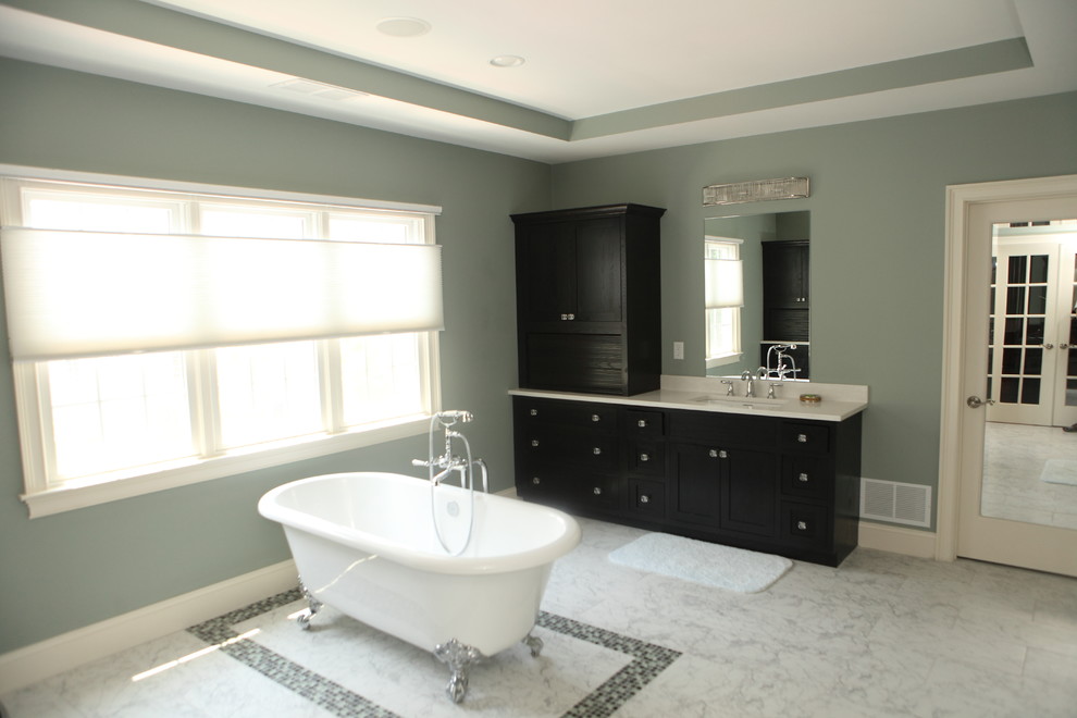 Inspiration for a modern multicolored tile and glass tile marble floor freestanding bathtub remodel in Providence with flat-panel cabinets, black cabinets, green walls, an undermount sink and granite countertops