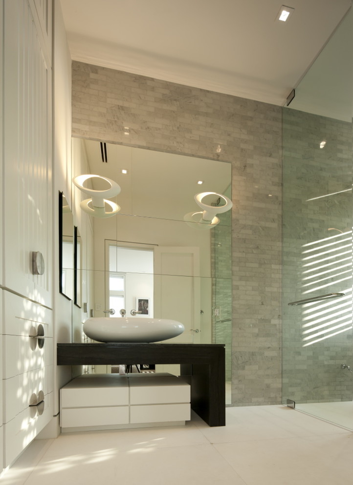 Inspiration for a modern bathroom in Other with a vessel sink.