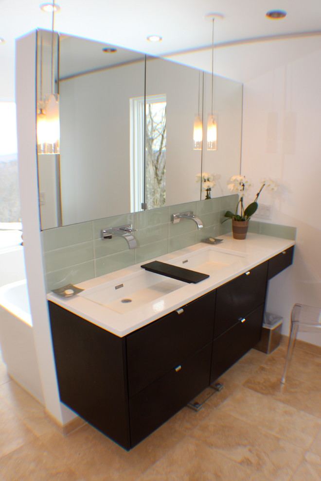 Modern bathroom in Boston with a trough sink, flat-panel cabinets, dark wood cabinets, engineered stone worktops, a freestanding bath, a built-in shower, a wall mounted toilet, beige tiles and stone tiles.