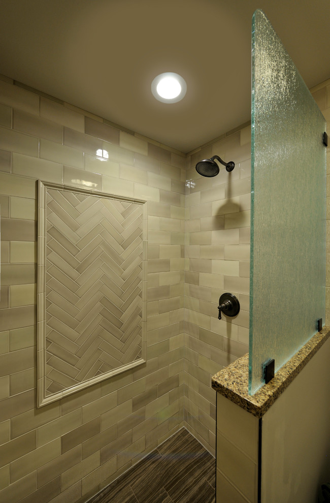 Inspiration for a mid-sized transitional master beige tile and porcelain tile porcelain tile and brown floor bathroom remodel in Other with recessed-panel cabinets, medium tone wood cabinets, white walls, an undermount sink, granite countertops and an urinal