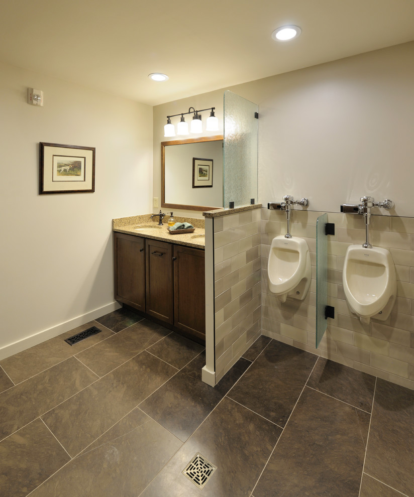 This is an example of a medium sized traditional ensuite half tiled bathroom in Other with recessed-panel cabinets, medium wood cabinets, beige tiles, porcelain tiles, white walls, porcelain flooring, a submerged sink, granite worktops, brown floors, a walk-in shower, an urinal and an open shower.