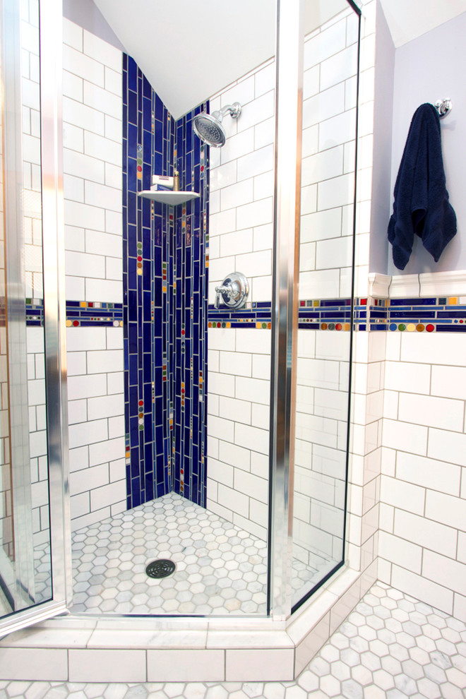 Mid-sized minimalist 3/4 multicolored tile and mosaic tile marble floor corner shower photo in Minneapolis with a drop-in sink, recessed-panel cabinets, medium tone wood cabinets, a one-piece toilet and blue walls
