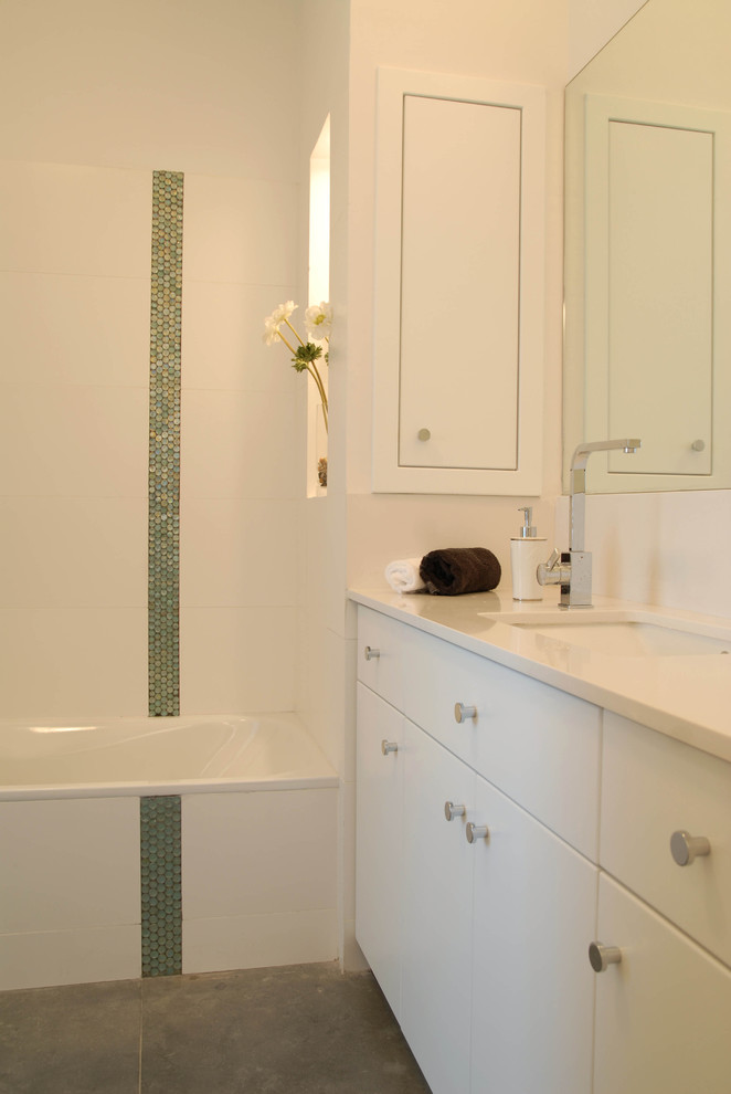 This is an example of a modern bathroom in Other with mosaic tiles.
