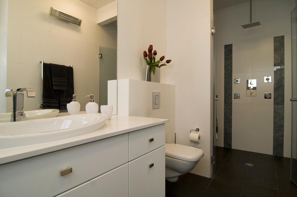 Photo of a modern bathroom in Other with a vessel sink.