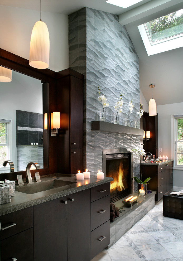 Bathroom - mid-sized contemporary gray tile and porcelain tile bathroom idea in New York with flat-panel cabinets, concrete countertops, a one-piece toilet, an integrated sink, dark wood cabinets, white walls and gray countertops