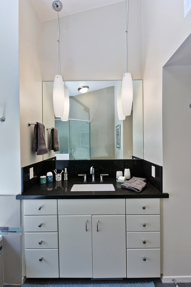 This is an example of a medium sized modern ensuite bathroom in San Diego with a submerged sink, flat-panel cabinets, white cabinets, engineered stone worktops, a built-in bath, a corner shower, a two-piece toilet, beige tiles, porcelain tiles, beige walls and ceramic flooring.