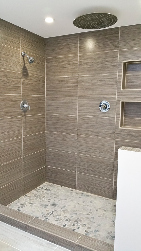 Example of a large minimalist master gray tile and pebble tile porcelain tile bathroom design in Chicago with an undermount sink, quartzite countertops and gray walls
