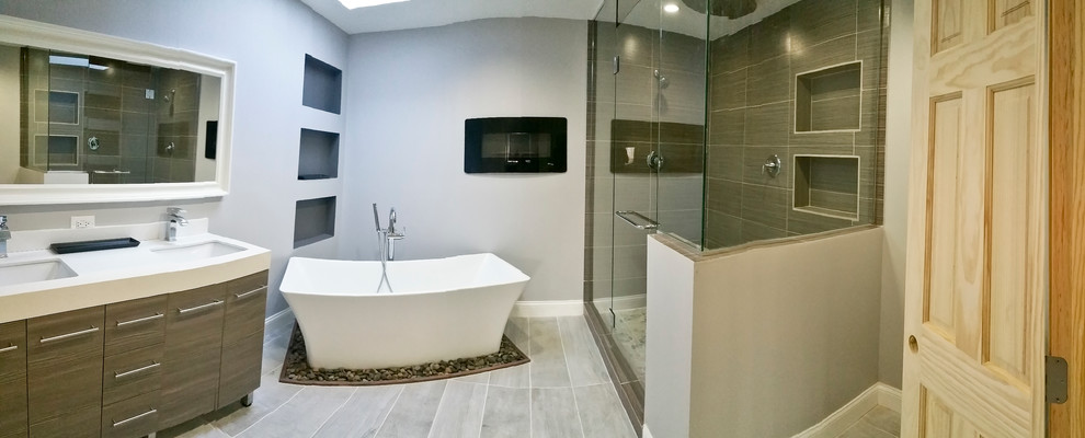 Large minimalist master corner shower photo in Chicago with an undermount sink, quartzite countertops and gray walls