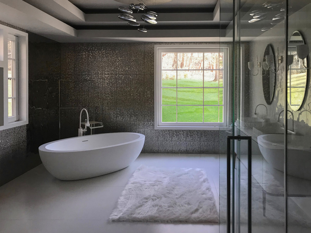 Example of a large trendy master porcelain tile ceramic tile and white floor bathroom design in Los Angeles with furniture-like cabinets, white cabinets, a wall-mount toilet, gray walls, a vessel sink, solid surface countertops, a hinged shower door and white countertops