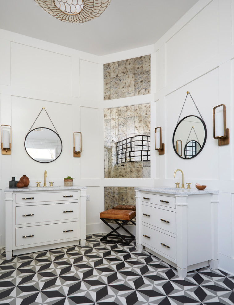 Classic bathroom in Chicago with white cabinets, mirror tiles, white walls, a submerged sink, multi-coloured floors, white worktops, cement flooring and flat-panel cabinets.