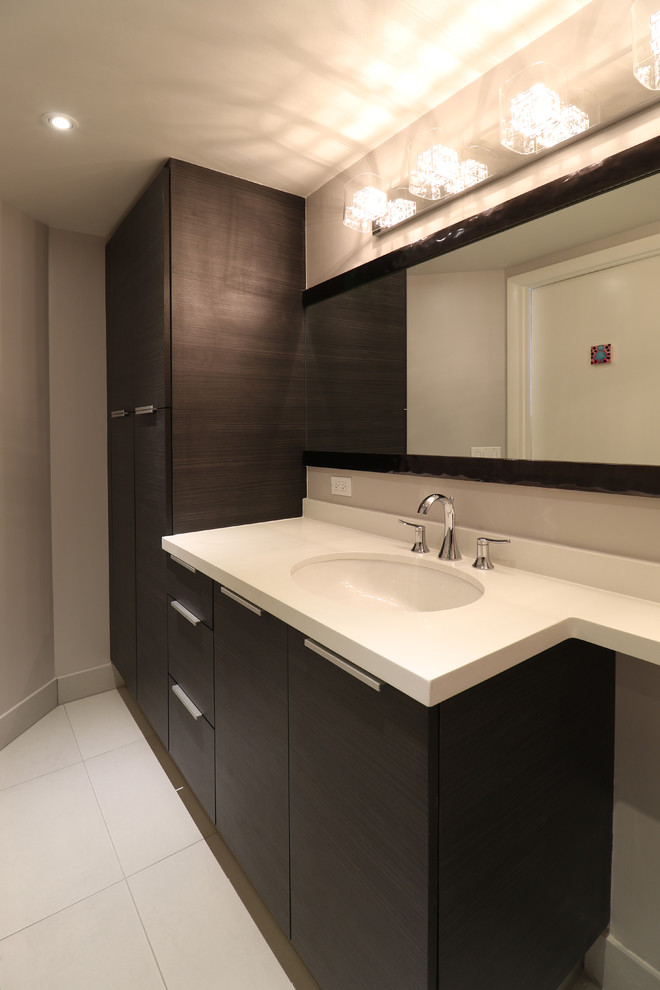 Medium sized modern shower room bathroom in Miami with a submerged sink, flat-panel cabinets, dark wood cabinets, engineered stone worktops, an alcove shower, a two-piece toilet, grey tiles, porcelain tiles, grey walls and porcelain flooring.