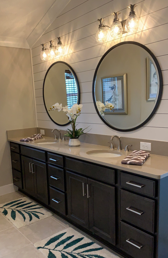 Example of a mid-sized island style master bathroom design in Orlando with recessed-panel cabinets, beige cabinets, an undermount sink, quartz countertops and beige countertops