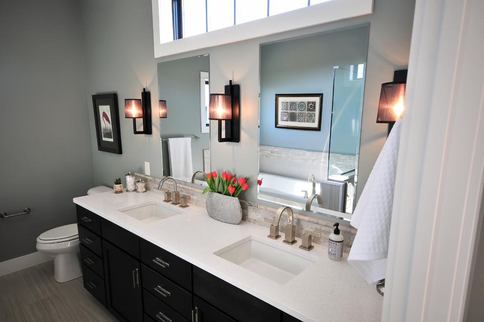 Bathroom - mid-sized transitional master gray tile and porcelain tile porcelain tile bathroom idea in Other with shaker cabinets, black cabinets, a one-piece toilet, gray walls, an undermount sink and quartzite countertops