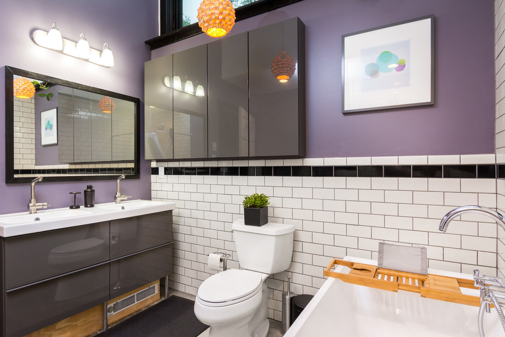 Inspiration for a mid-sized modern master white tile and subway tile bathroom remodel in Detroit with a one-piece toilet, purple walls and an integrated sink