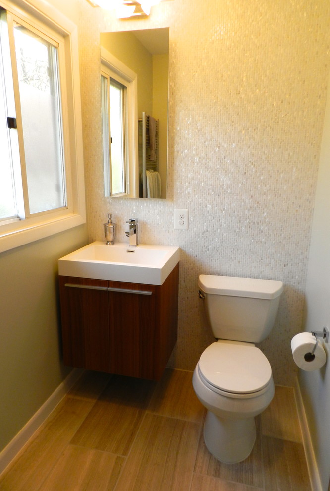 Inspiration for a small contemporary ensuite bathroom in DC Metro with a wall-mounted sink, flat-panel cabinets, medium wood cabinets, marble worktops, an alcove shower, a two-piece toilet, beige tiles, mosaic tiles, grey walls and marble flooring.