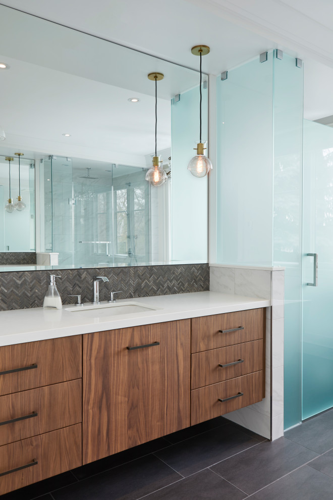 Example of a mid-sized trendy master white tile and porcelain tile porcelain tile, black floor and double-sink bathroom design in Toronto with flat-panel cabinets, medium tone wood cabinets, a two-piece toilet, white walls, an undermount sink, quartz countertops, white countertops and a floating vanity