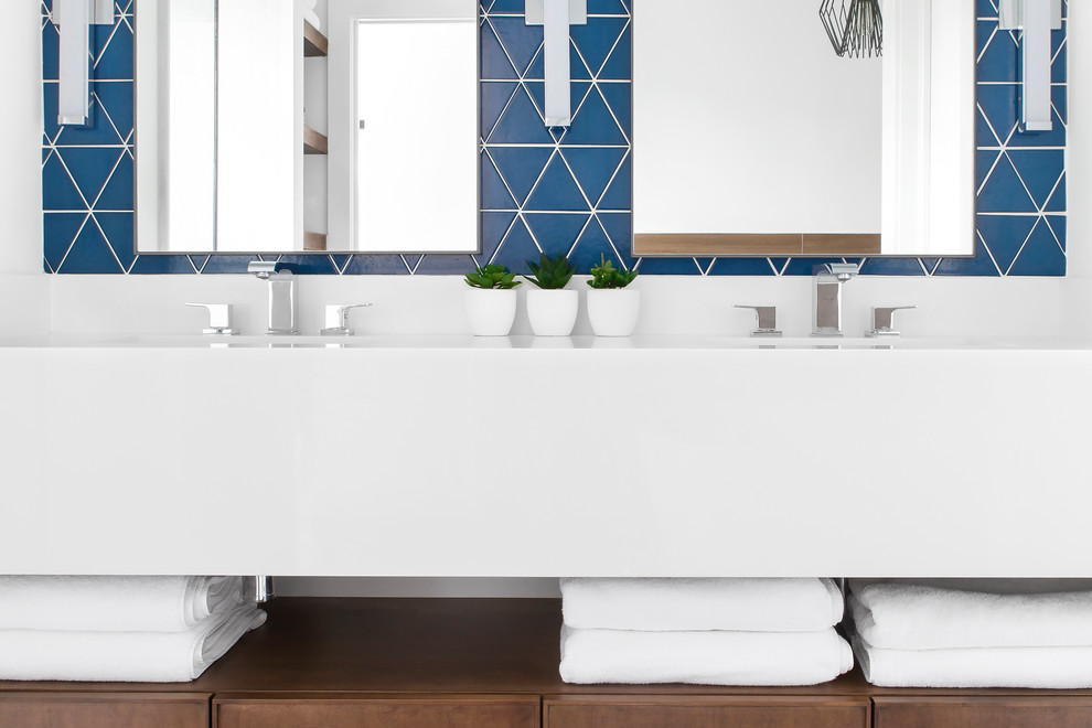 Inspiration for a large modern master blue tile and ceramic tile porcelain tile and black floor bathroom remodel in Toronto with flat-panel cabinets, medium tone wood cabinets, a two-piece toilet, white walls, an undermount sink, quartz countertops and white countertops