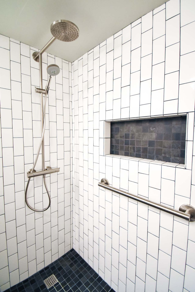 Inspiration for a small modern shower room bathroom in Portland with flat-panel cabinets, brown cabinets, an alcove shower, a two-piece toilet, white tiles, metro tiles, grey walls, ceramic flooring, an integrated sink, black floors, an open shower, white worktops, a wall niche, a single sink and a freestanding vanity unit.