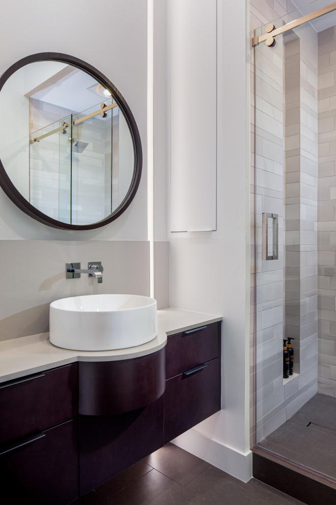 Small trendy 3/4 white tile and porcelain tile porcelain tile, gray floor and single-sink bathroom photo in Miami with flat-panel cabinets, dark wood cabinets, a two-piece toilet, white walls, a vessel sink, quartz countertops, gray countertops, a niche and a floating vanity