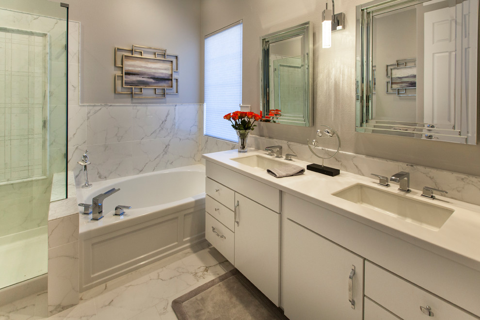 Mid-sized minimalist master white tile and porcelain tile porcelain tile and white floor alcove shower photo in Los Angeles with white cabinets, a two-piece toilet, an undermount sink, a hot tub, beige walls, quartzite countertops and flat-panel cabinets