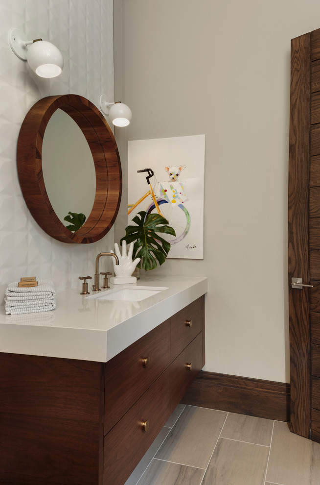 Example of a mid-sized minimalist kids' porcelain tile and beige floor bathroom design in Miami with flat-panel cabinets, dark wood cabinets, beige walls, an undermount sink and beige countertops