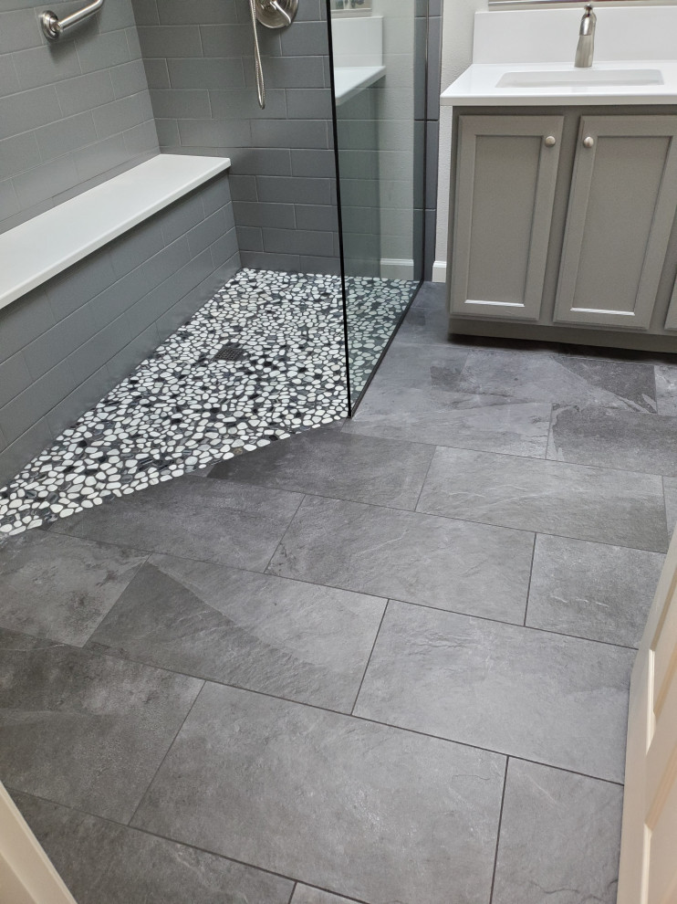 Inspiration for a mid-sized modern master gray tile and ceramic tile pebble tile floor, gray floor and double-sink bathroom remodel in Portland with shaker cabinets, gray cabinets, white walls, an undermount sink, quartz countertops, white countertops and a built-in vanity