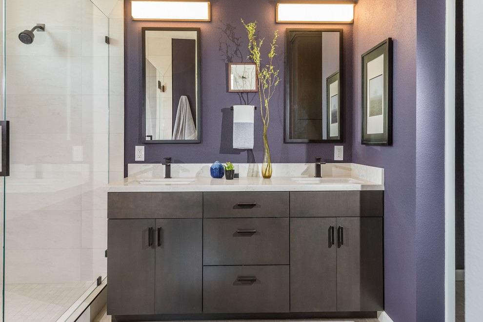 Bathroom - mid-sized contemporary master white tile and porcelain tile porcelain tile and beige floor bathroom idea in San Francisco with flat-panel cabinets, dark wood cabinets, a one-piece toilet, purple walls, an undermount sink, quartz countertops and a hinged shower door