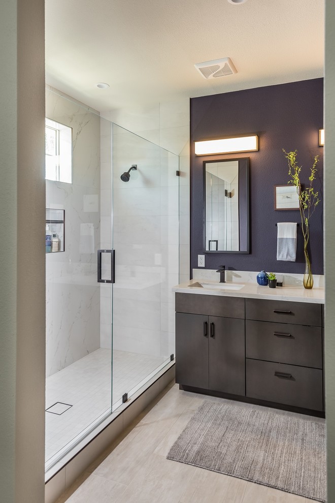 Mid-sized trendy master white tile and porcelain tile porcelain tile and beige floor bathroom photo in San Francisco with flat-panel cabinets, dark wood cabinets, a one-piece toilet, purple walls, an undermount sink, quartz countertops and a hinged shower door