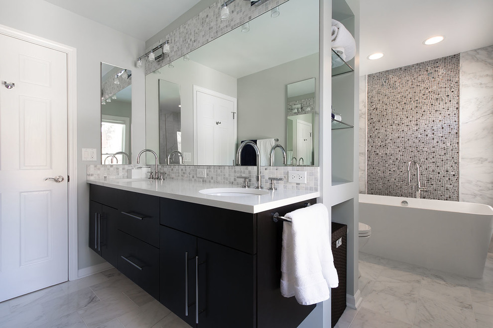 Inspiration for a large contemporary master white tile, gray tile, multicolored tile and mosaic tile porcelain tile bathroom remodel in Chicago with an undermount sink, flat-panel cabinets, quartz countertops, a one-piece toilet, black cabinets and gray walls
