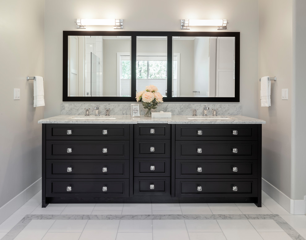 Example of a large transitional master white tile and stone tile marble floor and white floor bathroom design in San Francisco with furniture-like cabinets, black cabinets, a one-piece toilet, gray walls, an undermount sink, marble countertops, a hinged shower door and gray countertops