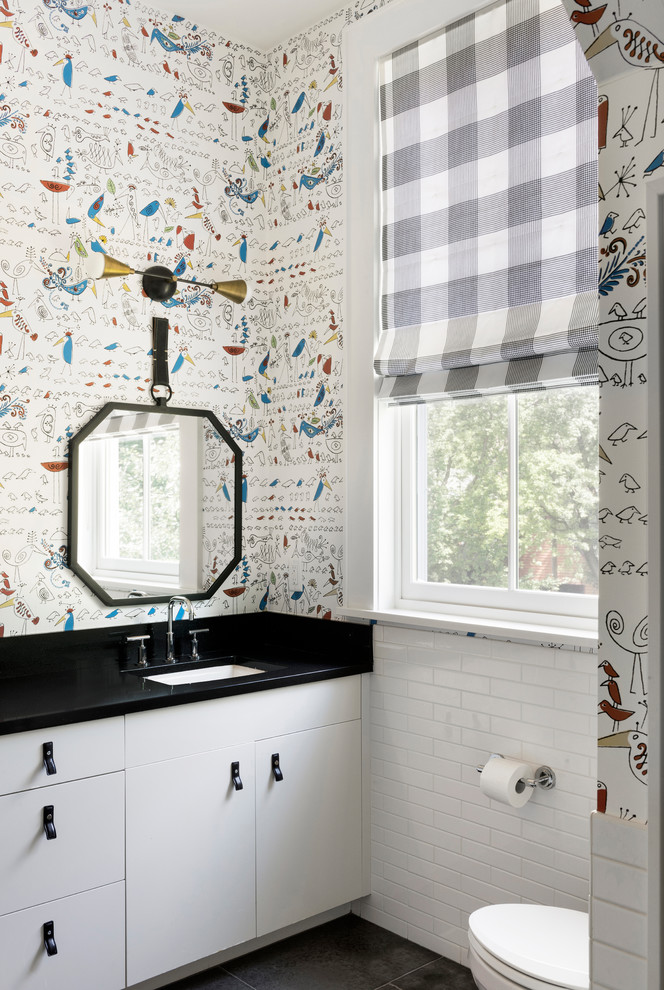 На фото: детская ванная комната в стиле неоклассика (современная классика) с плоскими фасадами, белыми фасадами, разноцветными стенами, врезной раковиной, черным полом, белой плиткой и плиткой кабанчик с