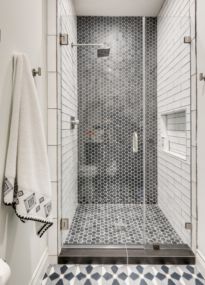 Cottage 3/4 gray tile and porcelain tile concrete floor and blue floor alcove shower photo in Austin with blue cabinets, quartz countertops and a hinged shower door