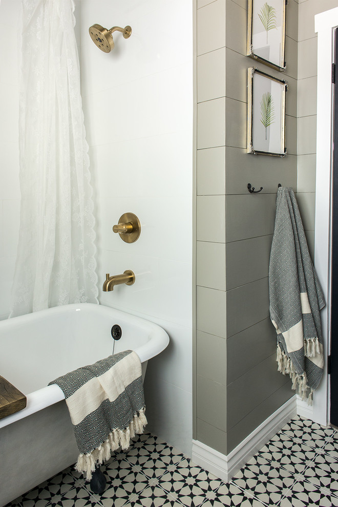 Example of a small farmhouse master cement tile floor and beige floor claw-foot bathtub design in Tampa with gray walls