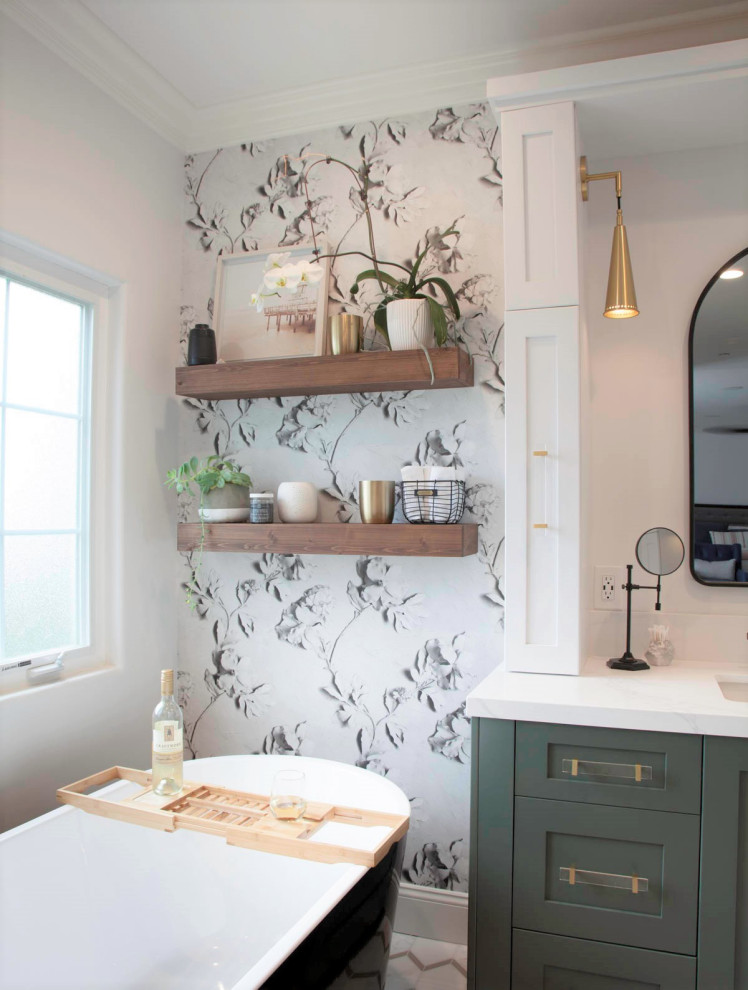 Photo of a medium sized country ensuite bathroom in Denver with recessed-panel cabinets, green cabinets, a freestanding bath, a walk-in shower, a two-piece toilet, white tiles, porcelain tiles, white walls, porcelain flooring, a submerged sink, engineered stone worktops, white floors, a hinged door, white worktops, a shower bench, a single sink, a built in vanity unit and wallpapered walls.