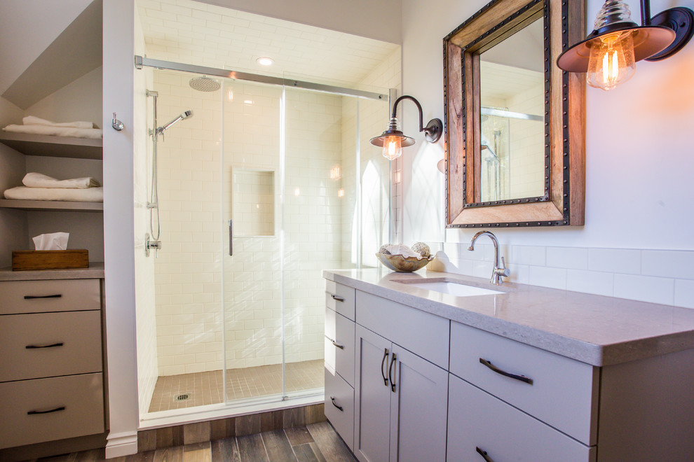 This is an example of a medium sized rural family bathroom in Toronto with a submerged sink, shaker cabinets, beige cabinets, engineered stone worktops, an alcove shower, a two-piece toilet, white tiles, porcelain tiles, white walls and porcelain flooring.