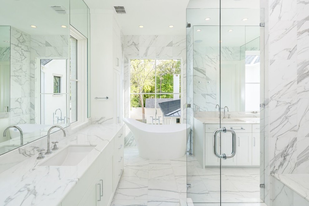 Bathroom - large traditional master marble tile marble floor and multicolored floor bathroom idea in Dallas with shaker cabinets, white cabinets, white walls, an undermount sink, marble countertops and a hinged shower door