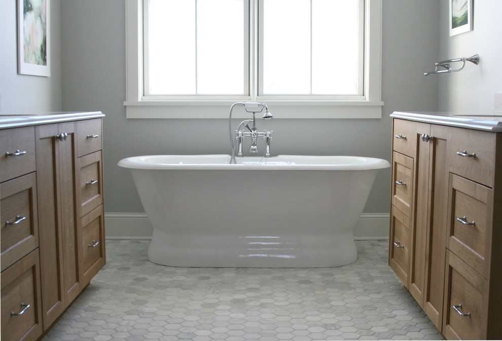 Bathroom - large farmhouse master pebble tile floor and gray floor bathroom idea in Minneapolis with recessed-panel cabinets, medium tone wood cabinets and gray walls