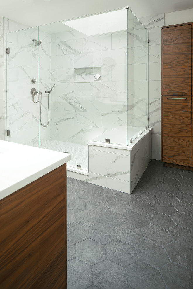Bathroom - cottage master porcelain tile porcelain tile and gray floor bathroom idea in Denver with flat-panel cabinets, medium tone wood cabinets, white walls, an undermount sink, quartz countertops, a hinged shower door and white countertops