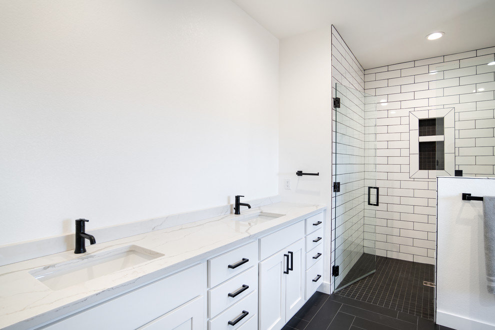 Large country master white tile and subway tile porcelain tile and gray floor alcove shower photo in Other with shaker cabinets, white cabinets, white walls, an undermount sink, quartz countertops, a hinged shower door and white countertops