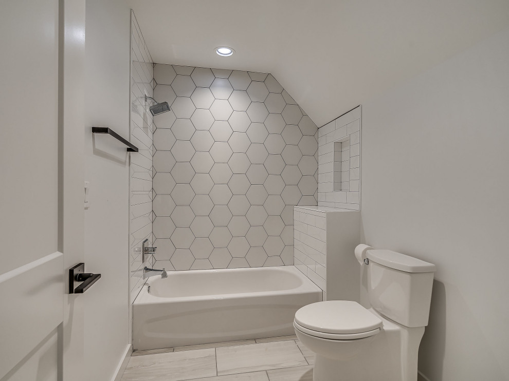 This is an example of a medium sized country shower room bathroom with shaker cabinets, white cabinets, a shower/bath combination, white tiles, ceramic tiles, grey walls, ceramic flooring, a submerged sink, engineered stone worktops, white floors, brown worktops, double sinks and a built in vanity unit.