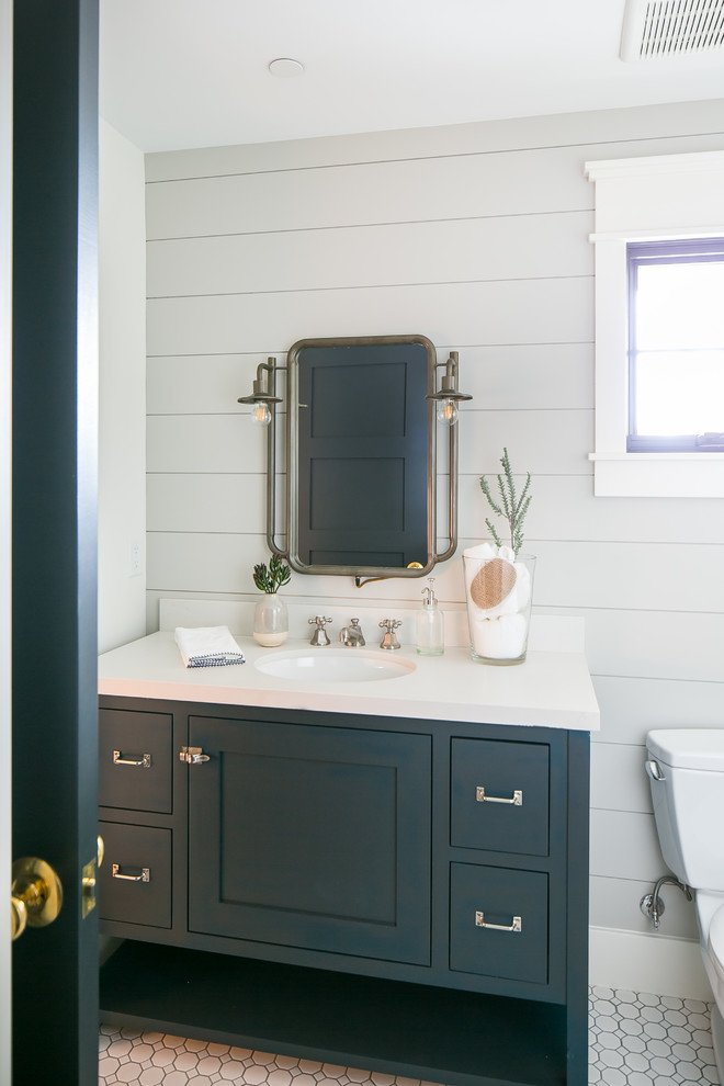 This is an example of a medium sized farmhouse family bathroom in Phoenix with blue cabinets, grey tiles, porcelain flooring, concrete worktops and white floors.